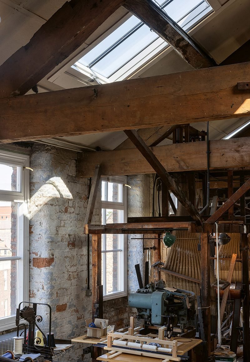 The timber internal face of the new roof windows is sympathetic to existing structure and finishes.