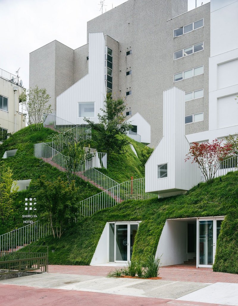 The Green Tower, a new structure created by Fujimoto resembles a small grassy hill, home to guestrooms, a sauna and hilltop artworks by Tatsuo Miyajima.