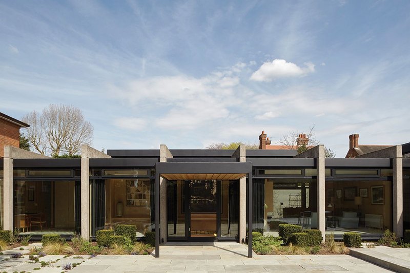 Giles & Pike’s refurbishment included a complete replacement of the floor to ceiling glazing, which sits behind the modernist house’s distinctive portal frame.