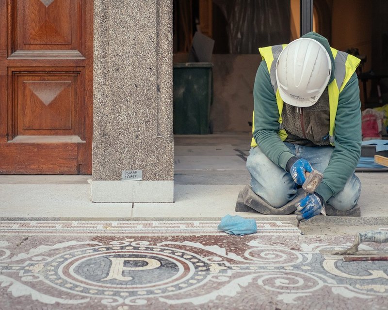 Restore London repairing the original mosaic floor at the National Portrait Gallery.