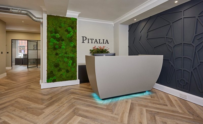 Pitalia real estate investment in Manchester. The reception desk is made from HIMACS solid surface material, an acrylic/mineral composite with natural pigments.