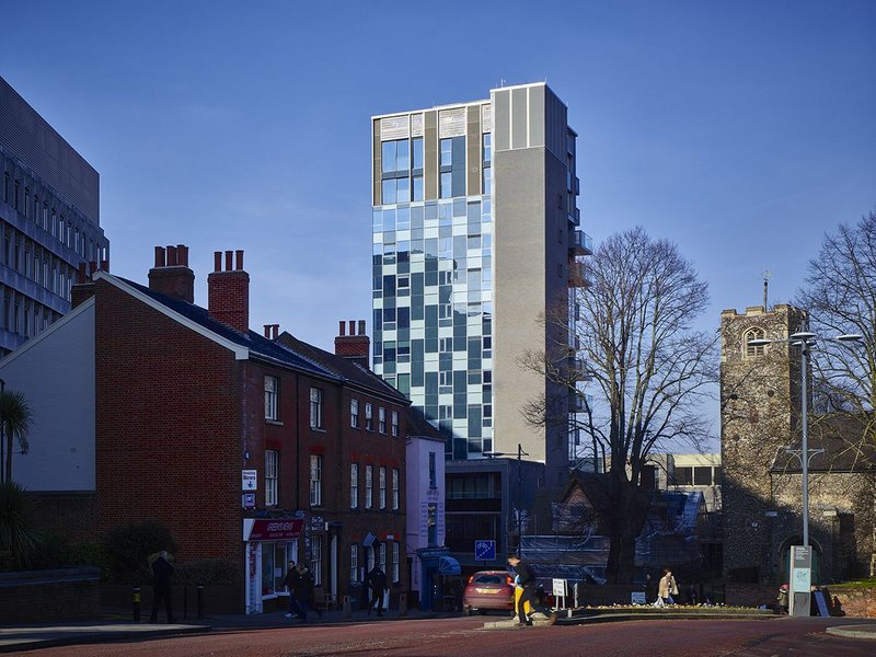 Sandwiched between the towers of Westlegate, the 17th century cottage at the base of the tower, still undergoing surgery.