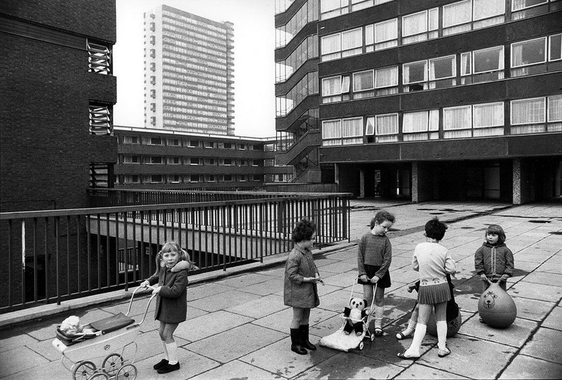 Tony Ray Jones, Pepys Estate, Deptford, London: children playing on a raised walkway, 1970.