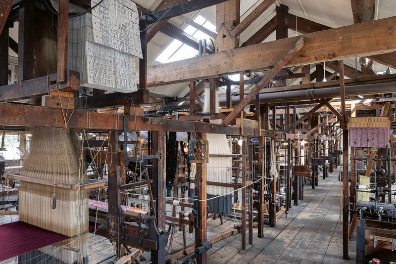 Good, even daylight enables visitors to appreciate the historic looms.