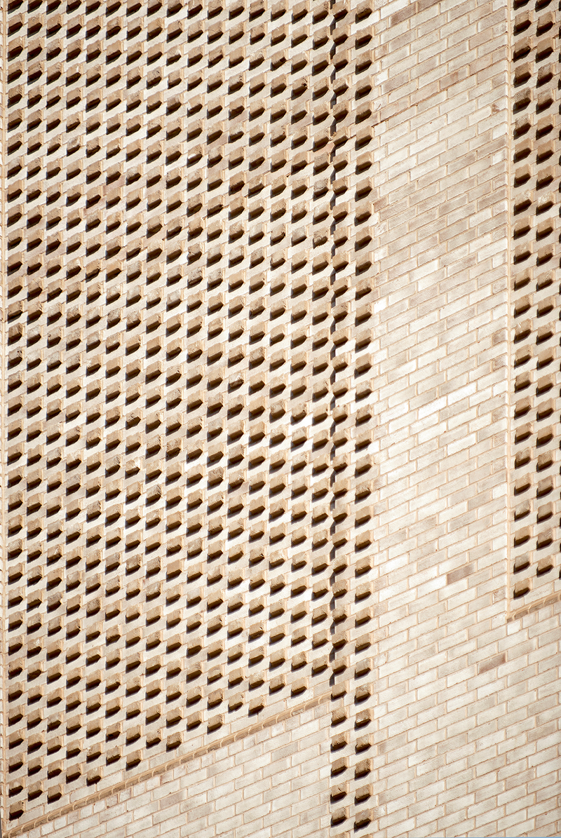 The top of the building incorporates a series projecting brick headers arranged in a square formation.