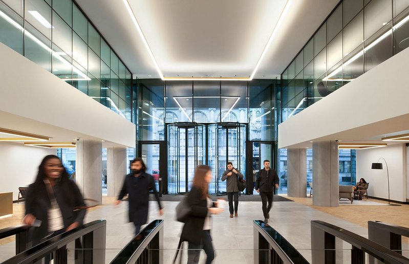 The entrance to the Riverscape offices in Queen Street Place, London with two Boon Edam Crystal Tourniket all-glass revolving doors.