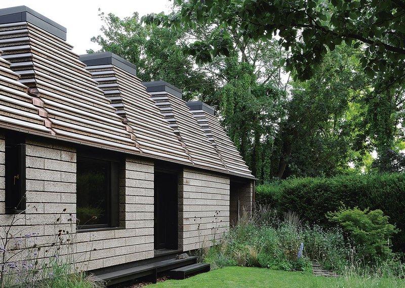 Borrowing masonry corbelled forms for the cork blocks resulted in pyramidal roofs, effectively held down by the rooflights.