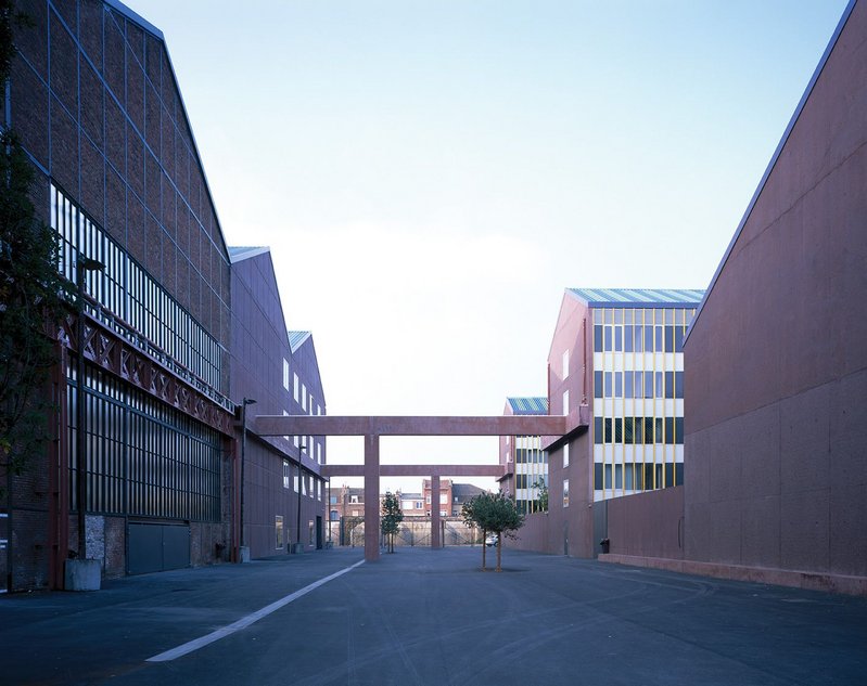 The schoolyard is gated at either end. Only the first building on the left is original, the rest are newly built in the ‘image’ of what was there before.