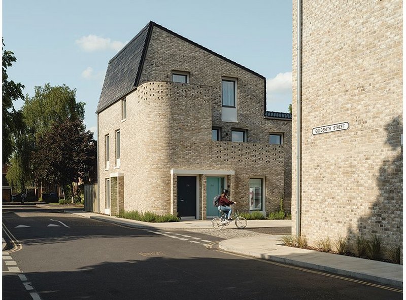 View along Goldsmith Street of one of the apartment blocks. Each has its own external space and front door.