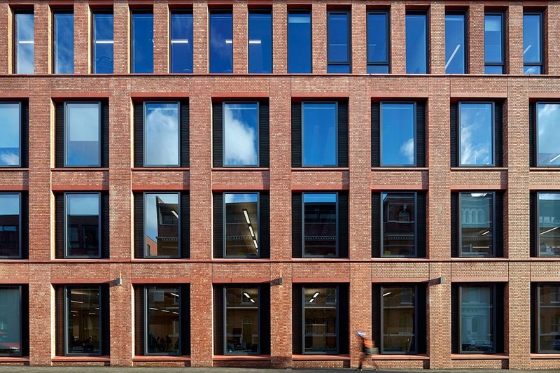 Detailing of the brick slips gives the facade a handmade feel.