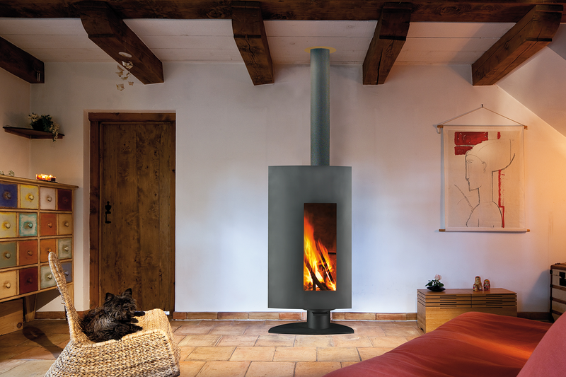 Stofocus Pivoting steel wood stove with triple-layered insulation and heat-resistant materials covering the entire inner surface of the firebox. The large, off-centre Pyroceramic glass screen is set in a curved facade and a side door opens to allow wood to be loaded.