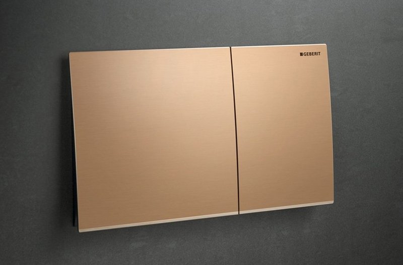 Geberit Sigma70 dual flush plate in Red Gold finish: giving architects, designers and specifiers added design flexibility.