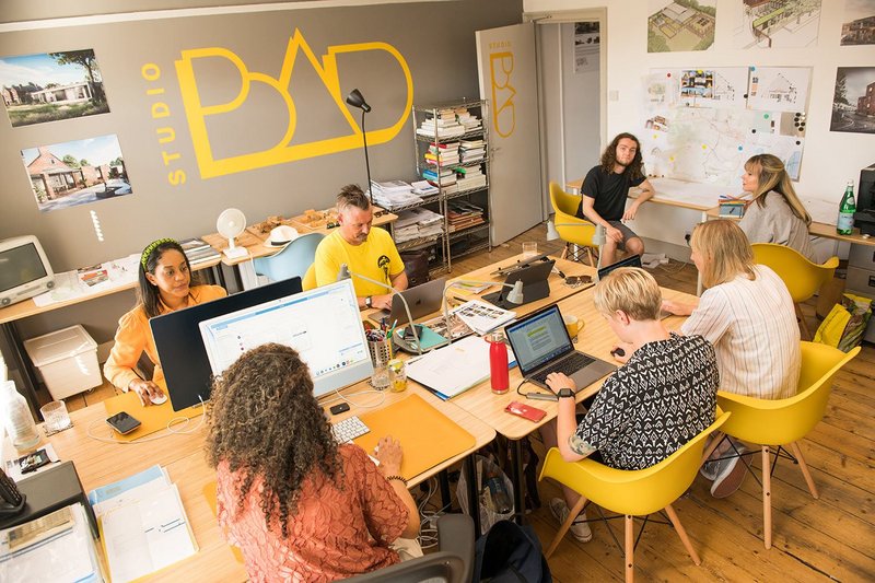 1.	Team at Studio B.A.D. Founding-director Darren Bray, who is dyslexic, is in the yellow t-shirt. Photo by Katie Louise of KLC Studios.