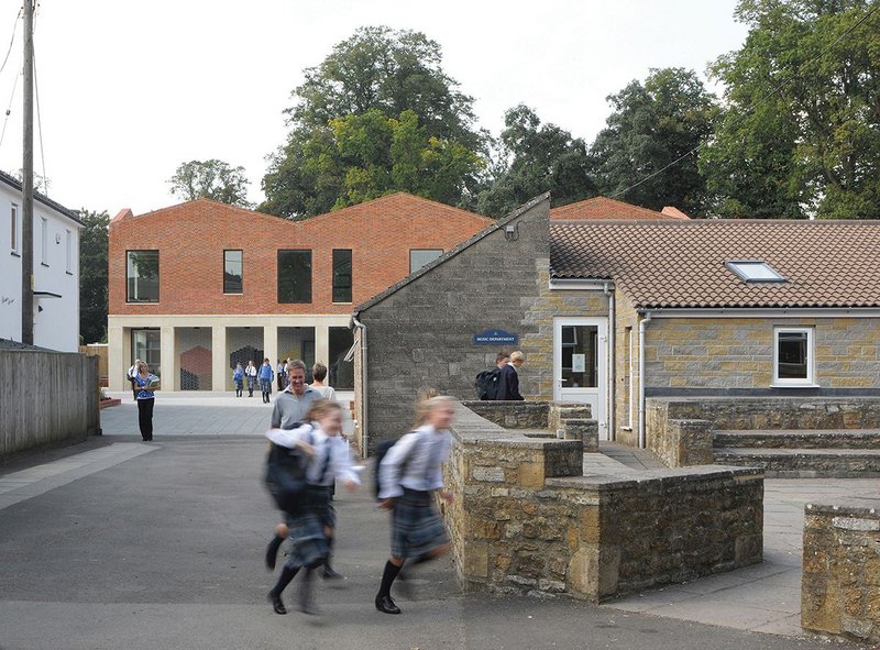 The new teaching block looking west, its formal facade bringing order to the piecemeal buildings behind the main house.