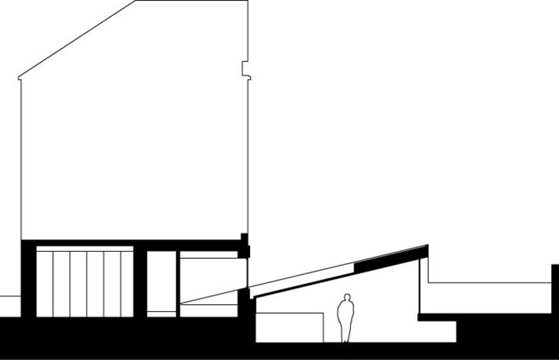 Section through the Cut House, with its angled  kitchen-diner.