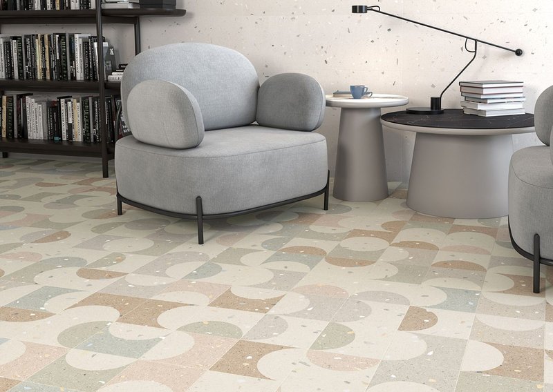 Croccante by Arcana: hi-tech porcelain floor tiles in multiple formats and subtle graphic and chromatic nuances. The curvaceous shapes of the retro-inspired Zeppole pattern are shown here.
