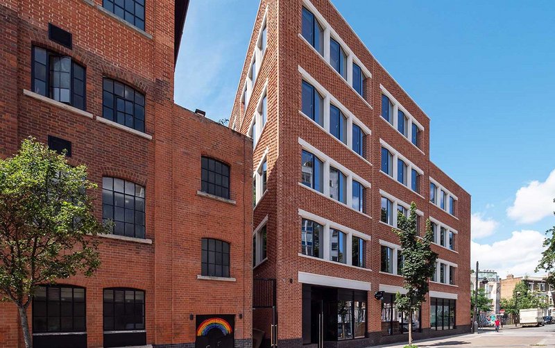 Squire & Partners' The Department Store Studios (right), Bellefields Road, Brixton. A blend of three red bricks, including snap headers, arranged to produce a rhythmic and textured finish.