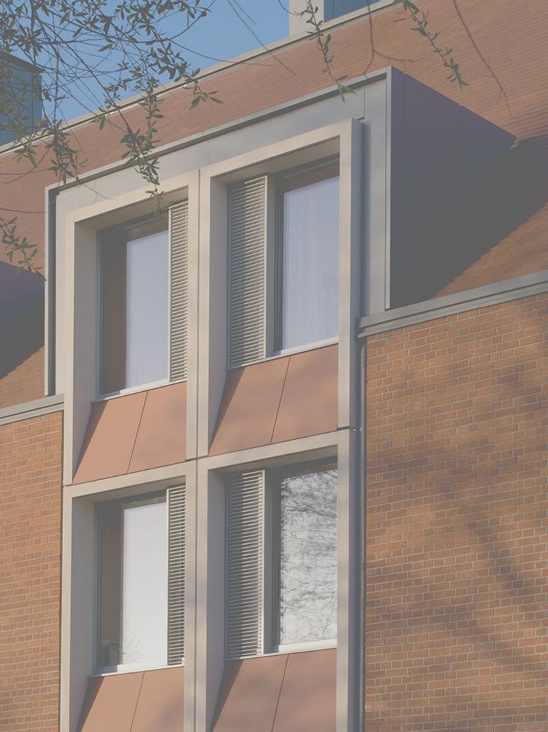 The north-east elevation combines triple-glazing within a super-insulated envelope.