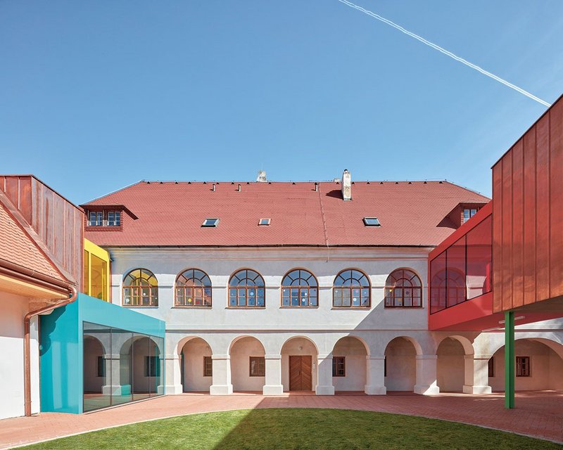 The courtyard has become the centre of things with playful new bridges that connect the main building with the wings behind.