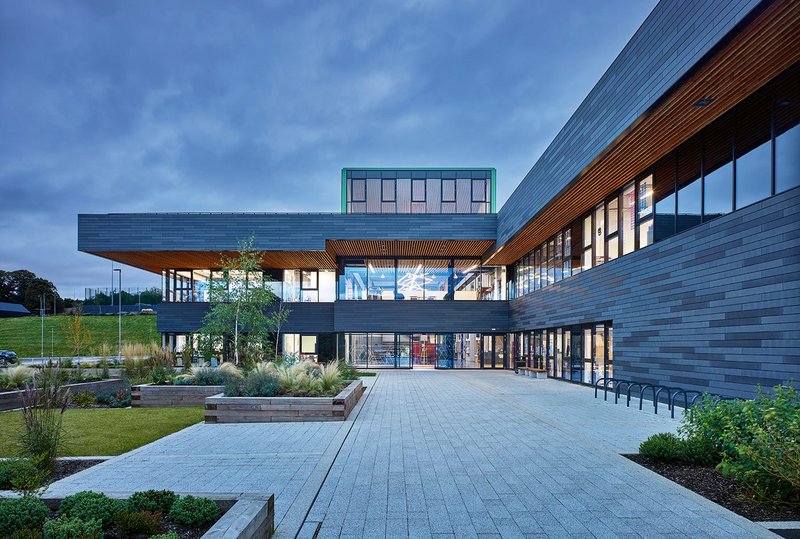 Approach to the main entrance. Charcoal-coloured GRC cladding was chosen for its robustness and patination, tying in with the architect’s notion of the building as striated rock formations.