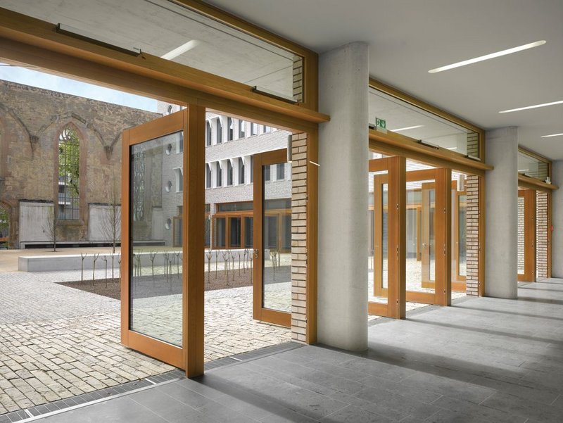 Large timber doors open directly onto the courtyard.