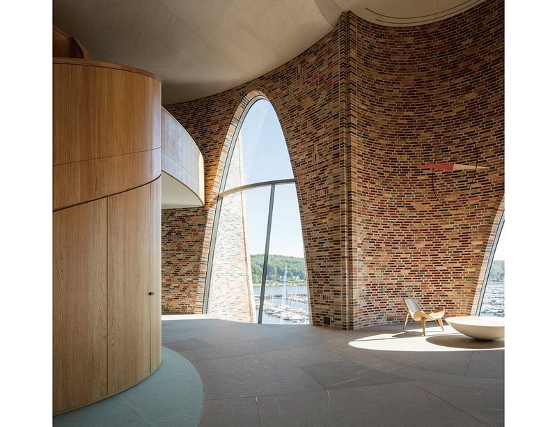 Interior of the Fjordenhus office, where a lack of horizontal surfaces evokes the sense of being on a boat.