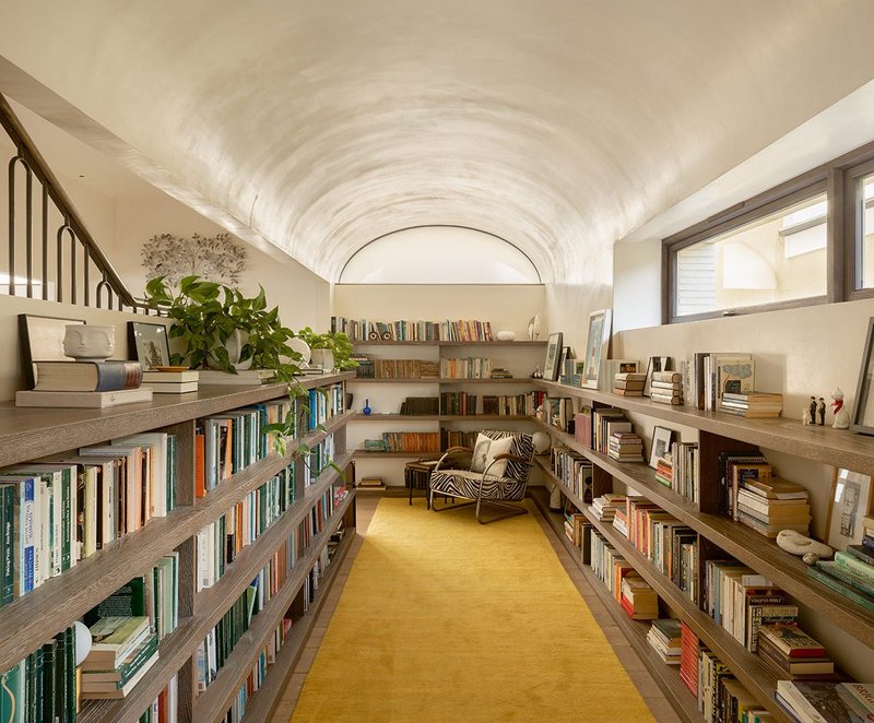 The first floor galleried library off the staircase and main living space under one of the barrel vaults.