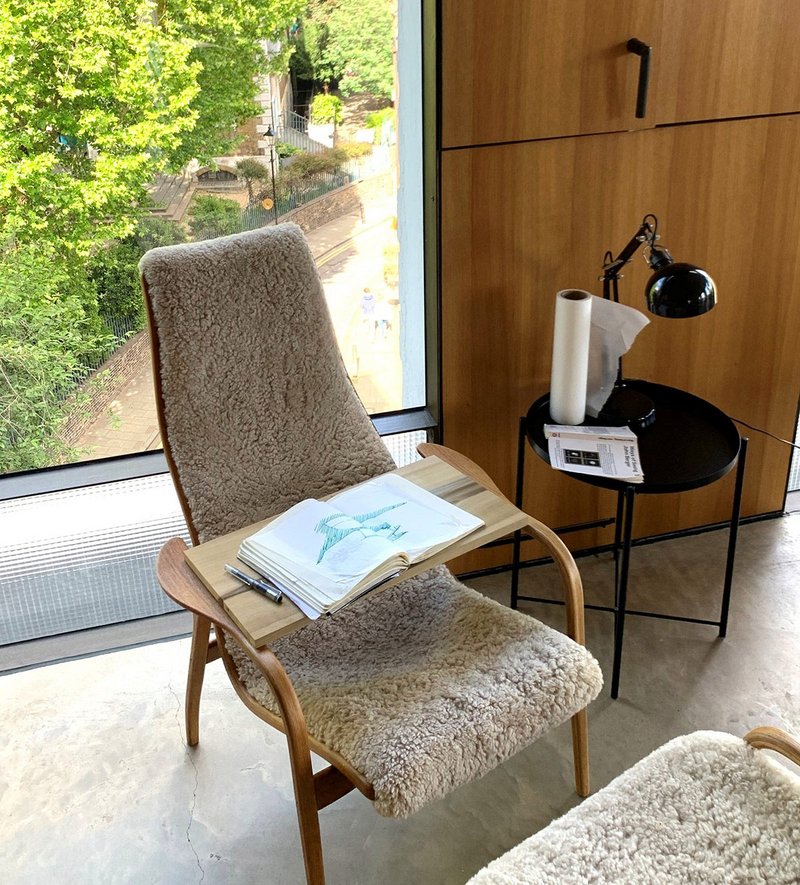 Refurbished 1956 Lamino chair by Yngve Ekström with Taha's sketchbook showing ideas for an Italian farmhouse project.