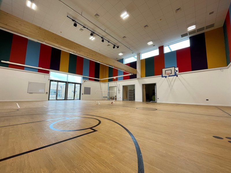 A sound absorbent grid ceiling with lots of wall panels to compensate for the double height space volume at a SEND school in Kent. It also shows how the panels can be used to enhance the aesthetics of the space rather than being an add on.