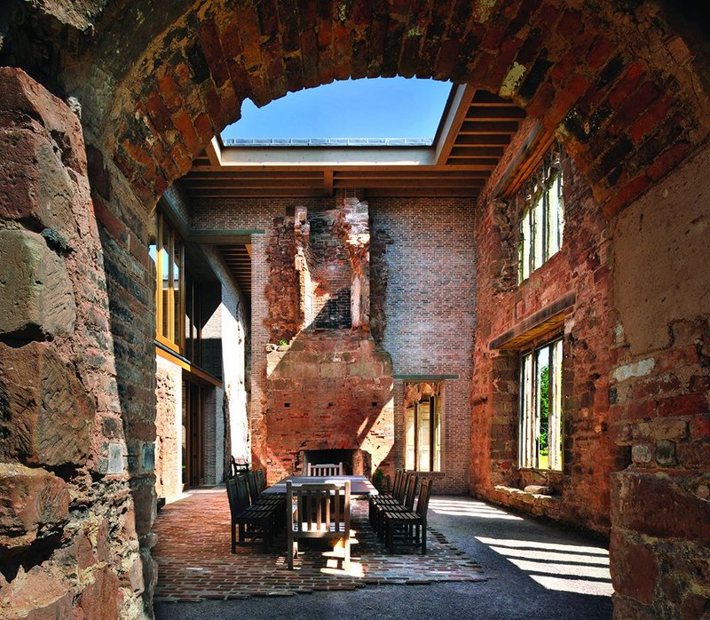 Lateral thinking on how to protect the inner face of stonework resulted in a partial timber roof, creating a Roman atrium above the courtyard.