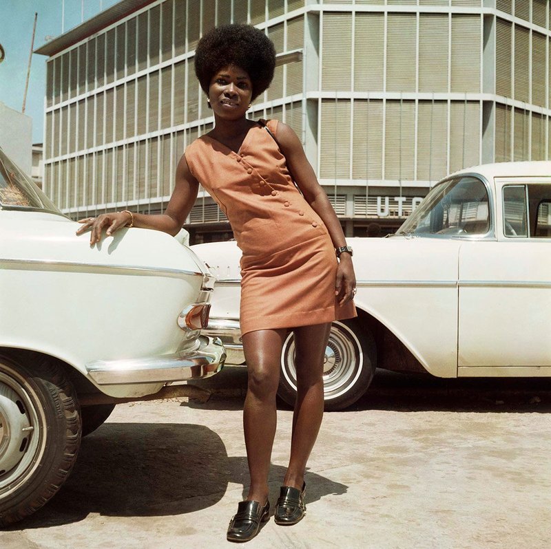 Sick-Hagemeyer store clerk posing in front of United Trading Company headquarters, Accra, 1971.