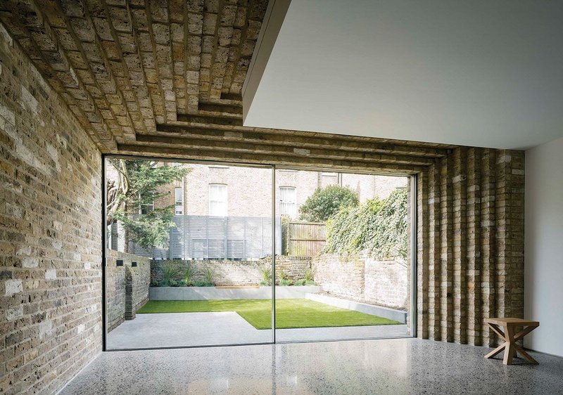 Brick slips create the illusion of a brick ceiling.