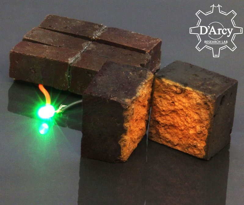 A brick supercapacitor powering an LED light.