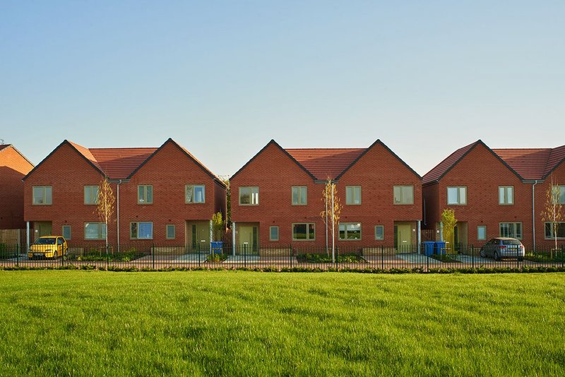 Green and yellow doors were inspired by the flash of a woodpecker. Umpire View by Sarah Wigglesworth Architects.