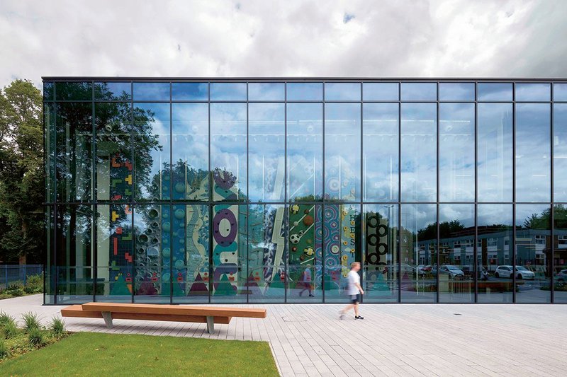 A new front section to the existing pool and sports hall is fronted up with a climbing wall.