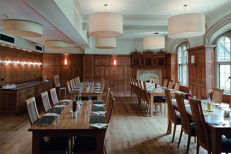 Stealing a slice of the courtyard extension has expanded the Shackleton Room enough to seat all the fellows. The beam (left) shows the line of the old wall.