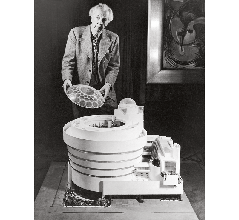 Frank Lloyd Wright with the large-scale model of his design for the Solomon R Guggenheim Museum.