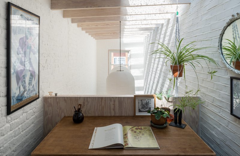 Architect Atelier Baulier's extension with Glazing Vision Multi-Part Flushglaze rooflight. The writing room occupies a mezzanine accessed from the first floor. Whitewashed brick slips mirror the original Victorian brickwork opposite.