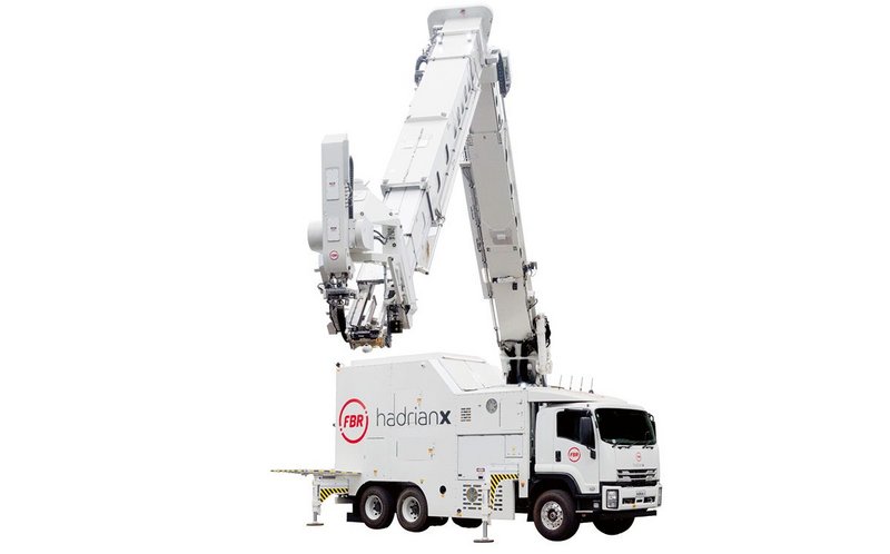 FBR’s Hadrian­‑X robot is mounted on a truck that manoeuvres around a site to build a home.