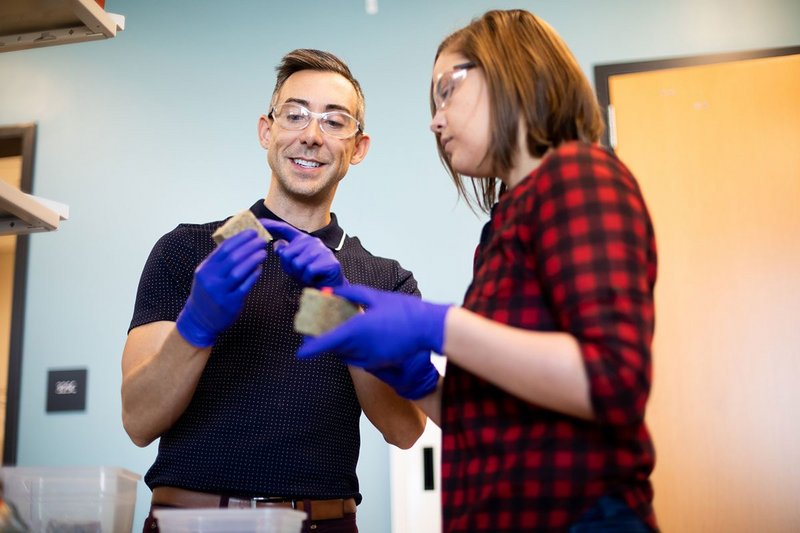 Wil Srubar, an assistant professor in the Department of Civil, Environmental and Architectural Engineering and CU Boulder graduate student Sarah Williams in the lab