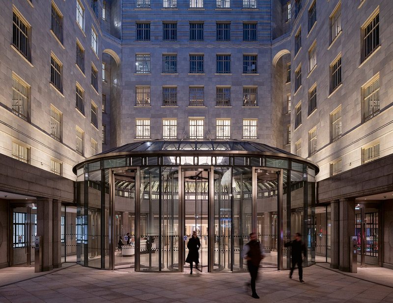 At night, the glow of the pavilion is complemented by lighting to the courtyard facades.