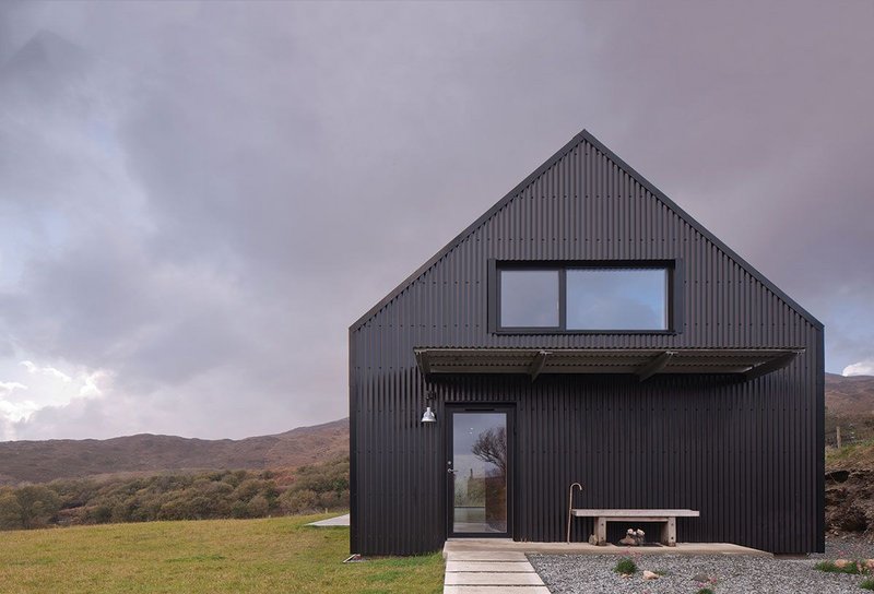 The house is reduced to three basic materials – aluminium sheeting, timber and resin.