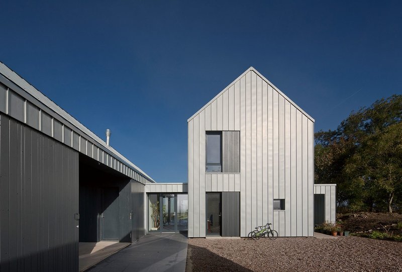 Exterior  zinc and timber cladding at Newhouse of Auchengee, designed around a three-sided courtyard.