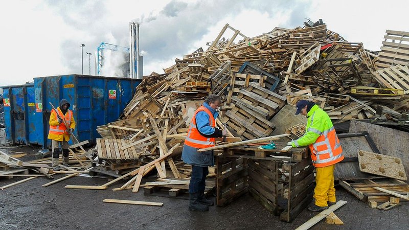 Low-grade timber salvaged from pallets and used to overclad existing and new buildings