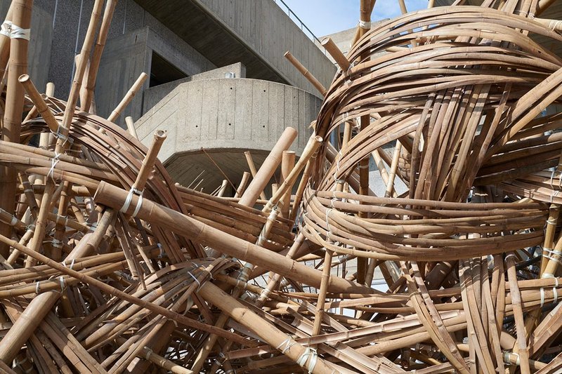 वेणु [Venu] by Asim Waqif, the Bagri Foundation Commission 2023. The bamboo contrasts strikingly with the concrete of the Hayward Gallery Terrace, London. Courtesy of the artist. Photo © Jo Underhill