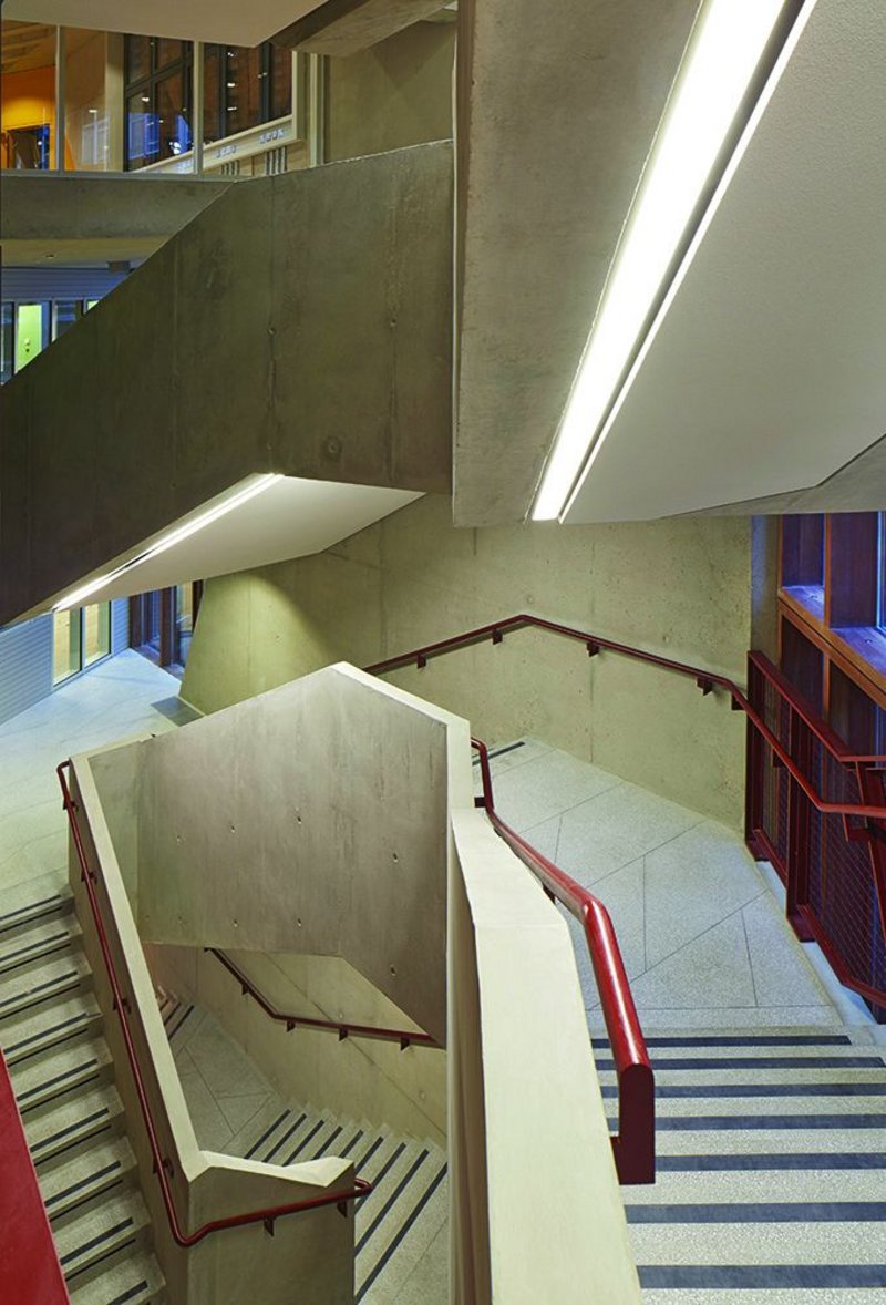 The luxury of austerity: the main stair is terrazzo and concrete, with painted steel and warm timber.