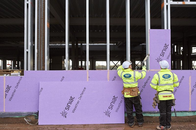 Installer fixing Siniat boards to frames Eastern High School, which has been designed by Powell Dobson.