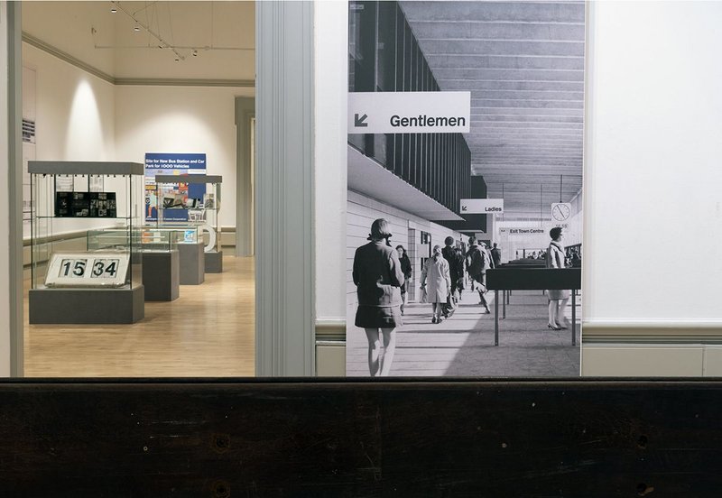 Installation of the Beautiful and Brutal– 50 Years in the life of Preston Bus Station exhibition. An archive interior image is on the right.