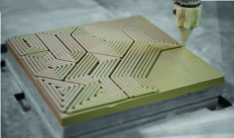 Ceramic tile being 3D printed by a robotic arm at Grymsdyke Farm for the Victoria and Albert Museum shop.