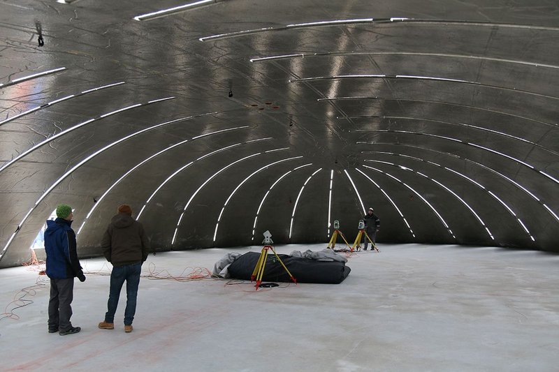Surveying work inside the concrete shell